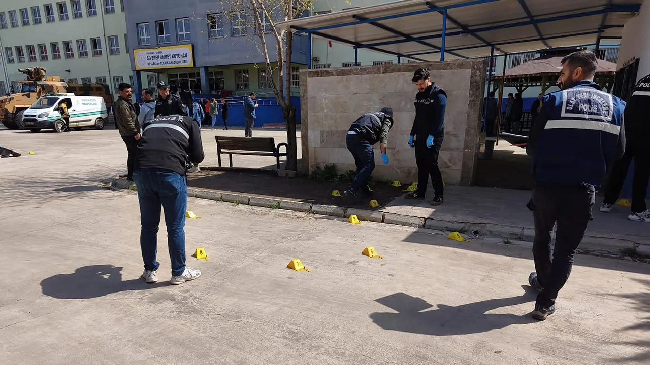Forensic police officers search the site after a teenager opened fire at a school and wounded at least 16 people, including students and teachers, before killing himself in Siverek, Sanliurfa province, Turkey, April 14, 2026. REUTERS/Sukru Dolas