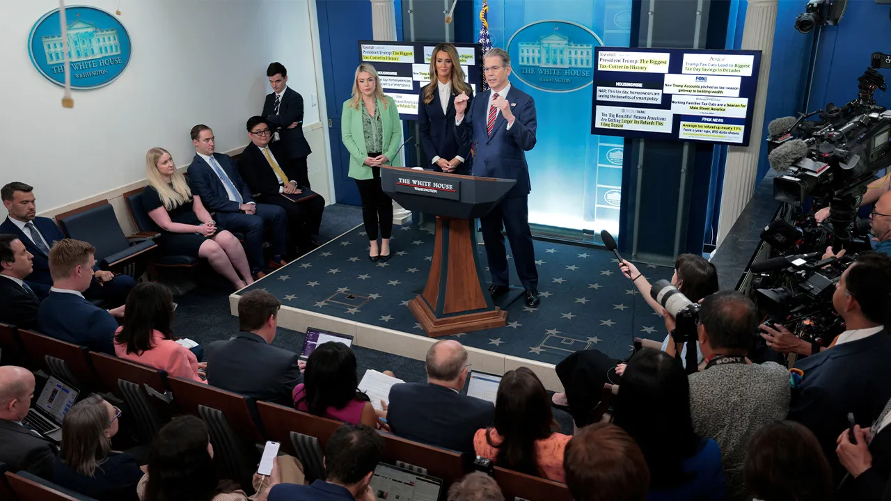White House Press Secretary Karoline Leavitt and Small Business Administrator Kelly Loeffler listen as U.S. Treasury Secretary Scott Bessent speaks during a press briefing in the James S. Brady Press Briefing Room at the White House in Washington, D.C., U.S., April 15, 2026. REUTERS/Evan Vucci