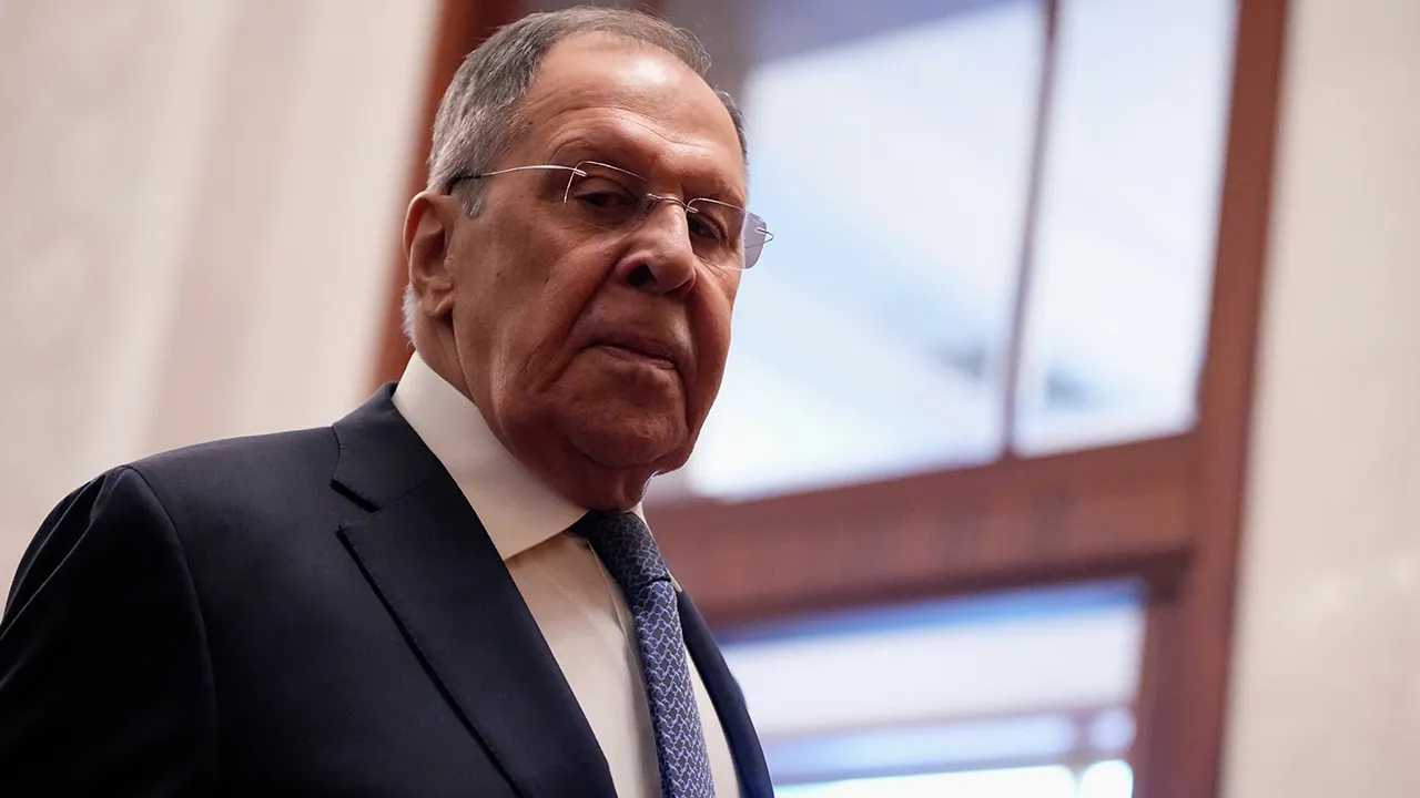 Russia's Foreign Minister Sergey Lavrov walks for a meeting with China's President Xi Jinping, at the Great Hall of the People in Beijing, China Wednesday, April 15, 2026. (Iori Sagisawa/Pool Photo via AP)