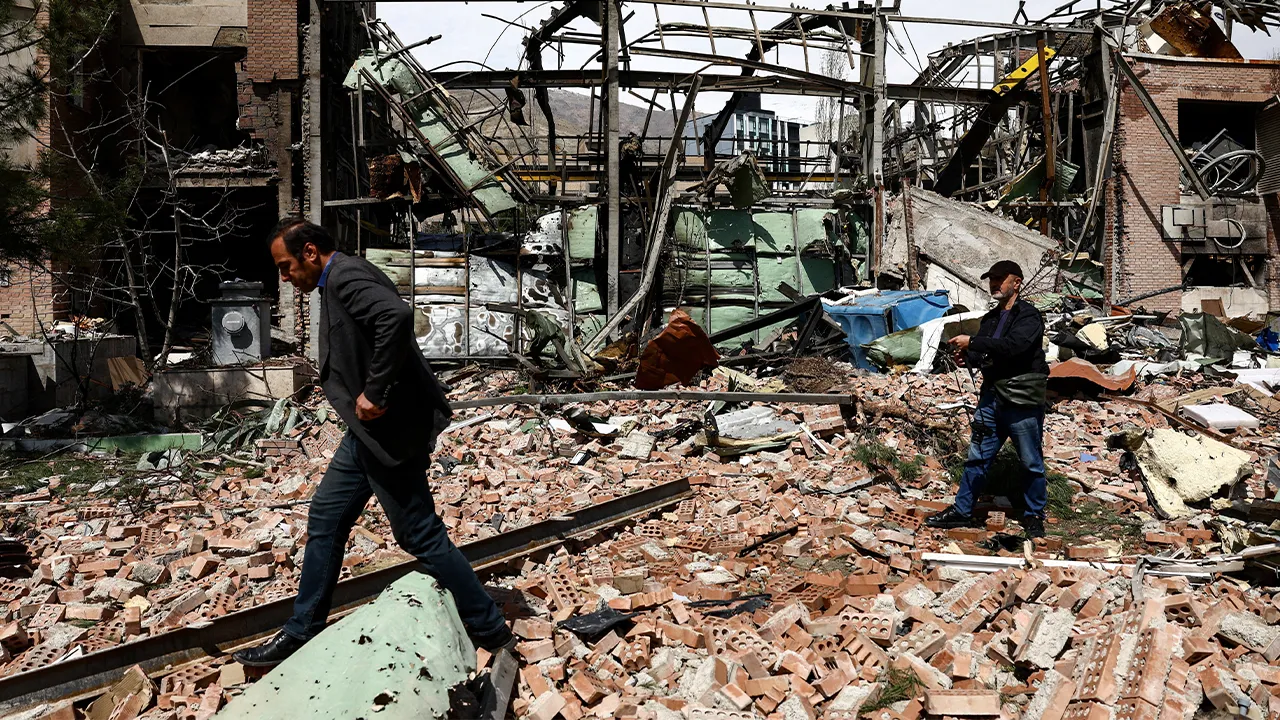 People inspect the damage at the research building of the Shahid Beheshti University, which was damaged by a strike, amid the U.S.-Israeli conflict with Iran, in Tehran, Iran, April 4, 2026. Majid Asgaripour/WANA (West Asia News Agency) via REUTERS ATTENTION EDITORS - THIS PICTURE WAS PROVIDED BY A THIRD PARTY TPX IMAGES OF THE DAY