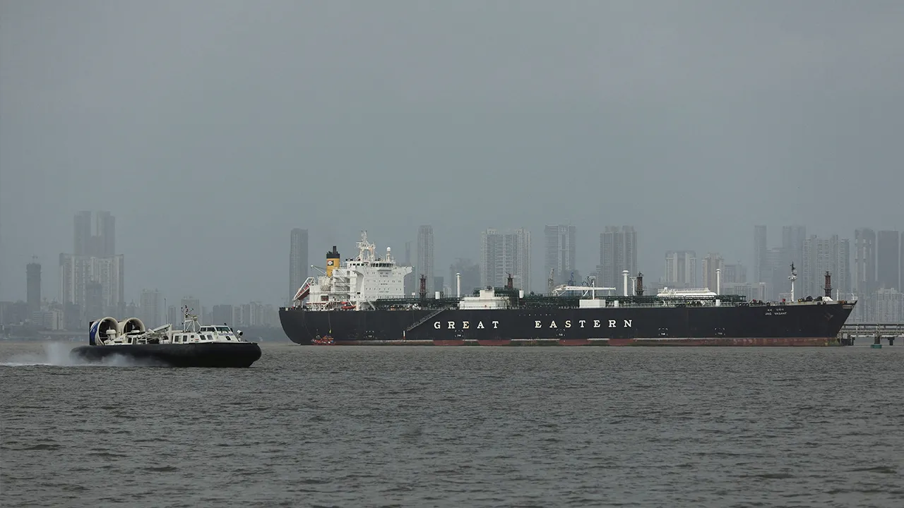 A hovercraft moves past the Jag Vasant vessel transferring LPG at a port after transiting the Strait of Hormuz amid supply disruptions linked to the U.S-Israeli conflict with Iran, in Mumbai, India, April 1, 2026. REUTERS/Francis Mascarenhas