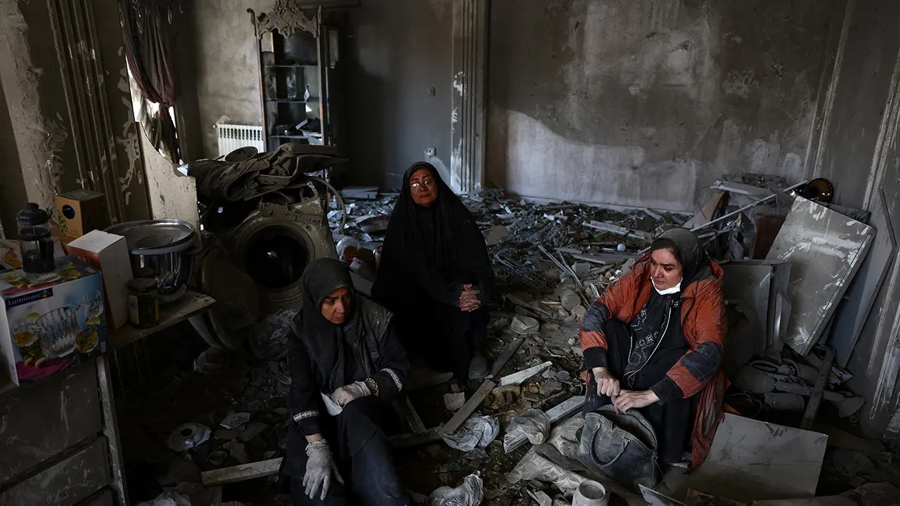 Women sit at a home, which was damaged by a strike, amid the U.S.-Israeli conflict with Iran, in Tehran, Iran, March 30, 2026. Majid Asgaripour/WANA (West Asia News Agency) via REUTERS ATTENTION EDITORS - THIS PICTURE WAS PROVIDED BY A THIRD PARTY