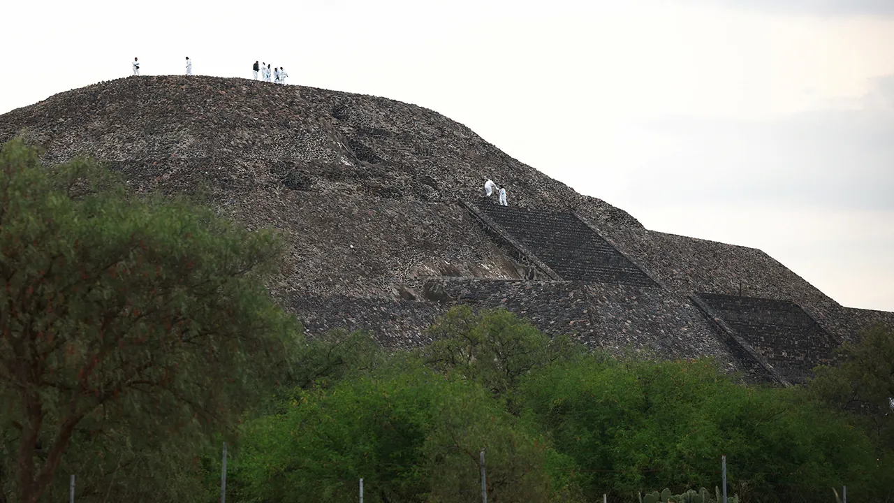 Mexican authorities work on the Pyramid of the Moon at the scene where a man shot dead a Canadian woman and injured several others before killing himself, Mexico's Security Cabinet says, according to preliminary information, at the Teotihuacan pyramids, a popular tourist and archaeological site on the outskirts of Mexico City, Mexico, April 20, 2026. REUTERS/Raquel Cunha