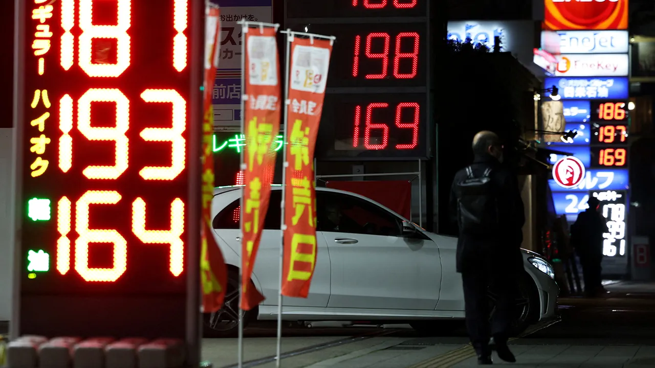 Signboards display fuel prices outside gas stations, amid the U.S.-Israel conflict with Iran, in Tokyo, Japan March 13, 2026. REUTERS/Issei Kato