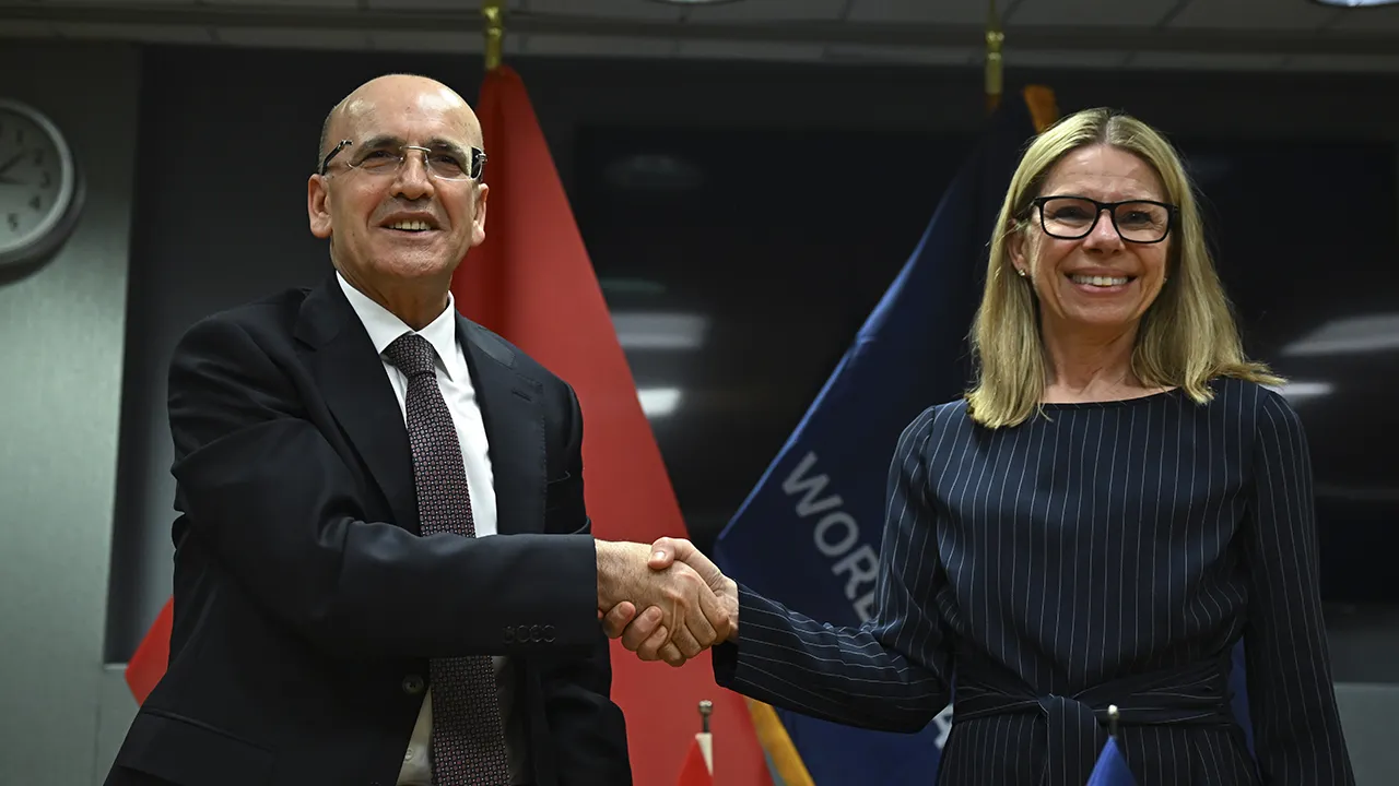 WASHINGTON DC, UNITED STATES - APRIL 14: Turkish Treasury and Finance Minister Mehmet Simsek and World Bank's managing director of operations Anna Bjerde pose for a photo during the signing ceremony for the financing agreement held at the World Bank headquarters in Washingon DC, United States on April 14, 2026. Simsek signed the agreement for â‚¬1.67 billion in financing provided by the World Bank under the Istanbul North Rail Crossing Project (INRAIL) Celal Gunes / Anadolu, Reuters