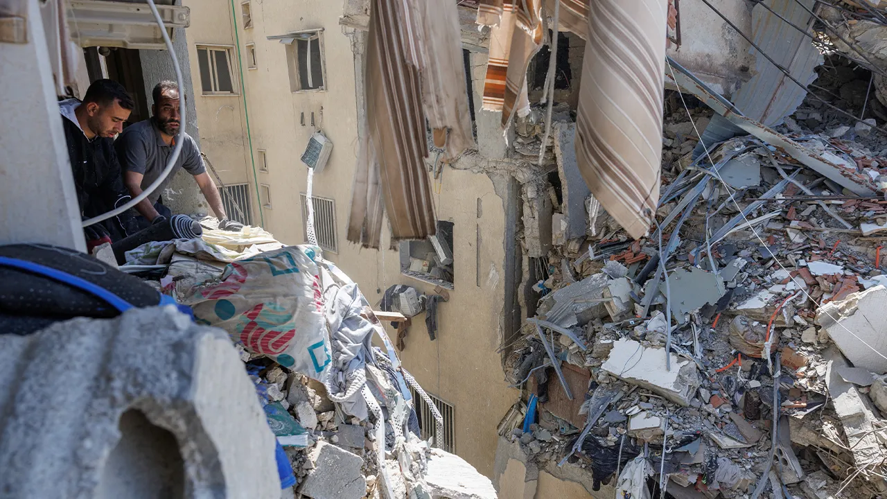 Residents clean their apartments in a building damaged by an Israeli strike, amid a temporary ceasefire between Lebanon and Israel, in Housh near Tyre, Lebanon, April 23, 2026. REUTERS/Zohra Bensemra