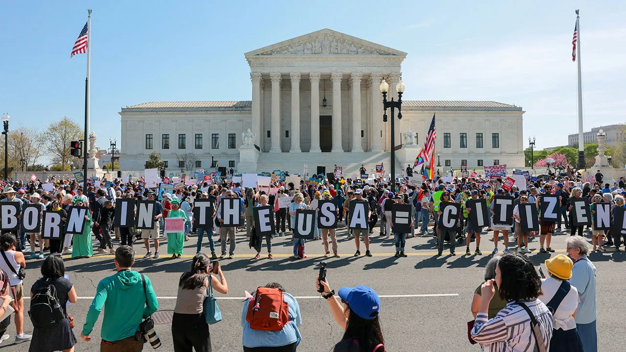 Demonstrators hold letters making up the slogan "Born in the USA = citizen!" outside the U.S. Supreme Court building as the court hears oral arguments on the legality of the Trump administration's effort to limit birthright citizenship for the children of immigrants, in Washington, D.C., U.S., April 1, 2026. REUTERS/Kylie Cooper