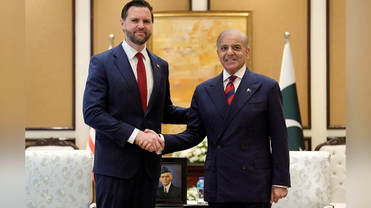 U.S. Vice President JD Vance and Pakistan's Prime Minister Shehbaz Sharif pose on the day of a meeting for talks about Iran, in Islamabad, Pakistan, April 11, 2026. Jacquelyn Martin/Pool via REUTERS TPX IMAGES OF THE DAY