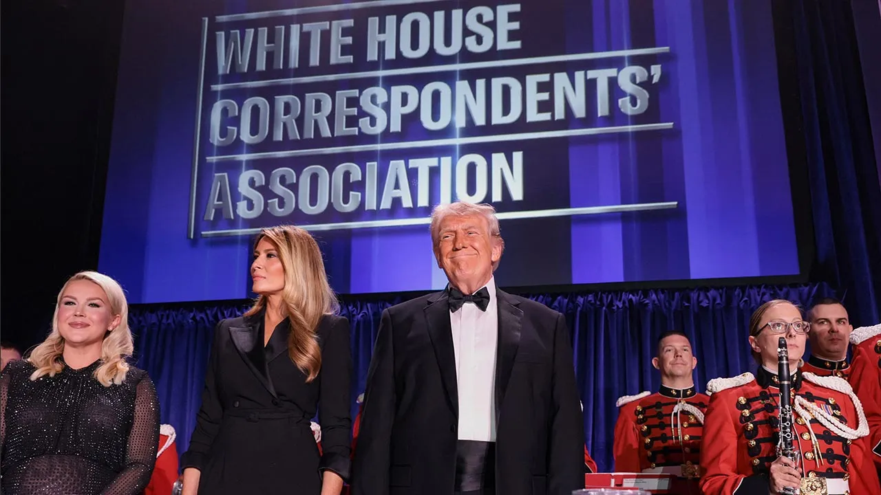 U.S. President Donald Trump and first lady Melania Trump, next to White House Press Secretary Karoline Leavitt, attend the annual White House Correspondents' Association dinner in Washington, D.C., U.S., April 25, 2026. REUTERS/Jonathan Ernst