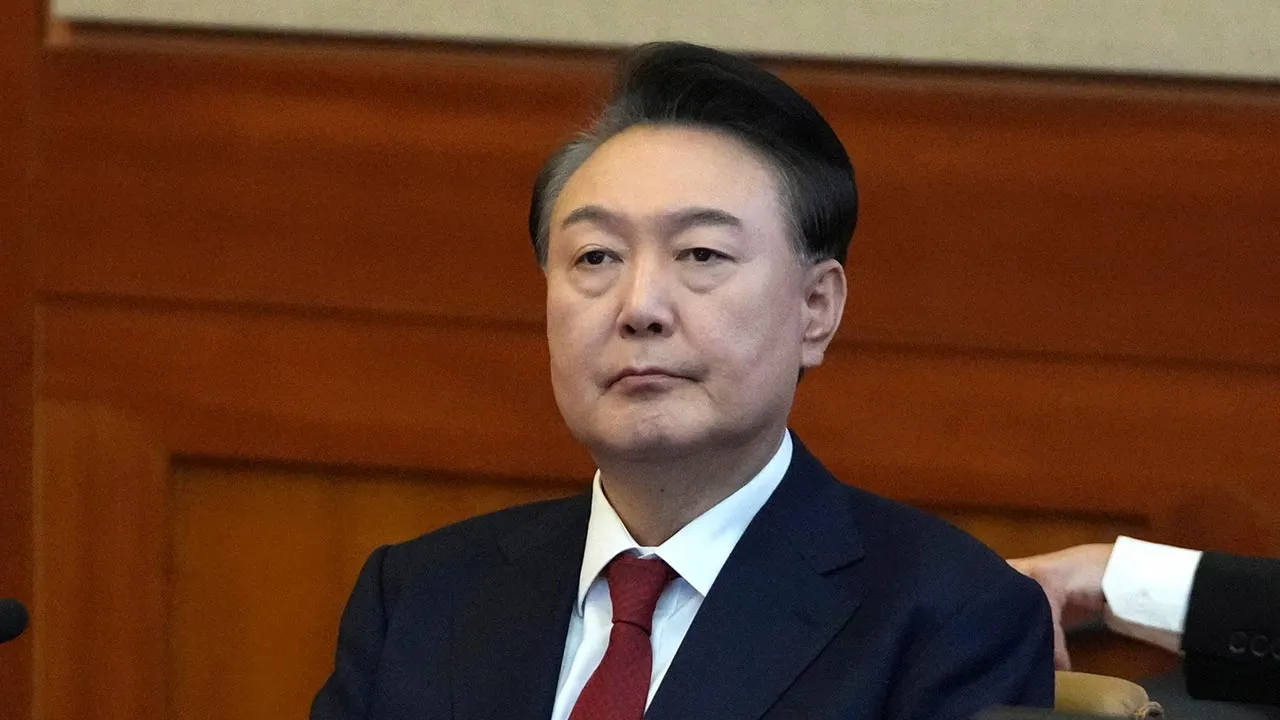 FILE - South Korea's impeached President Yoon Suk Yeol attends a hearing of his impeachment trial at the Constitutional Court in Seoul, South Korea, Feb. 11, 2025. (AP Photo/Lee Jin-man, Pool, File)