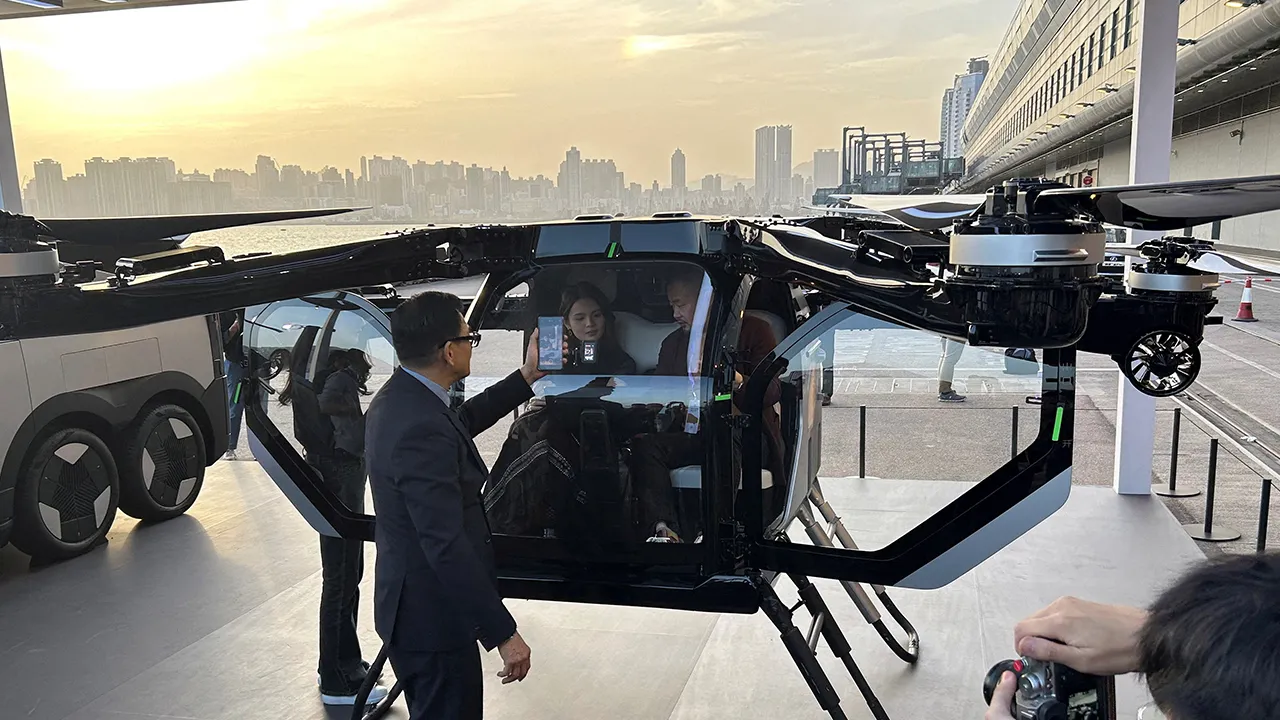File Photo: Chinese electric vehicle (EV) maker Xpeng displays a concept flying car, alongside a van designed to carry it, at a company event by the Victoria Harbour in Hong Kong, China April 15, 2025. REUTERS/Brian Thevenot/File Photo/File Photo