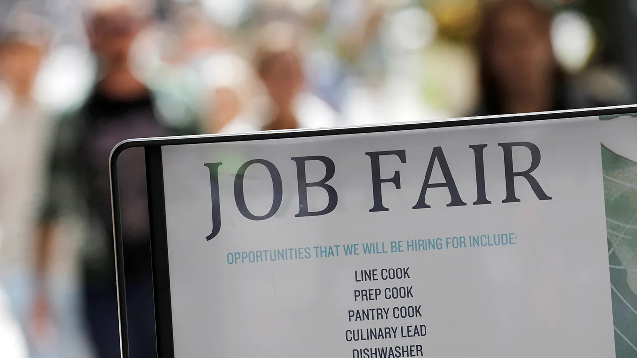 Signage for a job fair is seen on 5th Avenue after the release of the jobs report in Manhattan, New York City, U.S., September 3, 2021. REUTERS/Andrew Kelly/File Photo