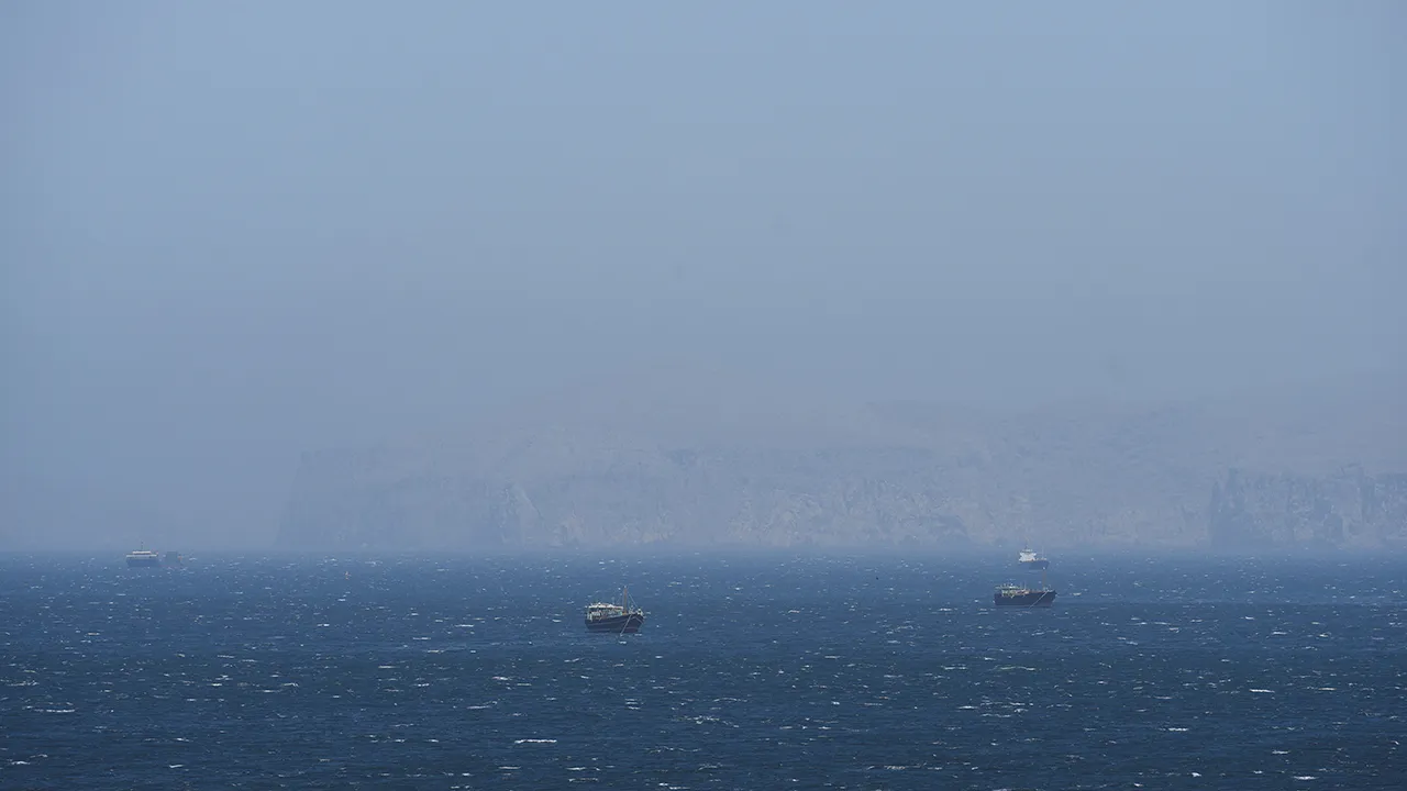 Vessels are off the coast of Musandam governorate, overlooking the strait of Hormuz, in Musandam governance, in Oman, April 8, 2026.REUTERS/Stringer