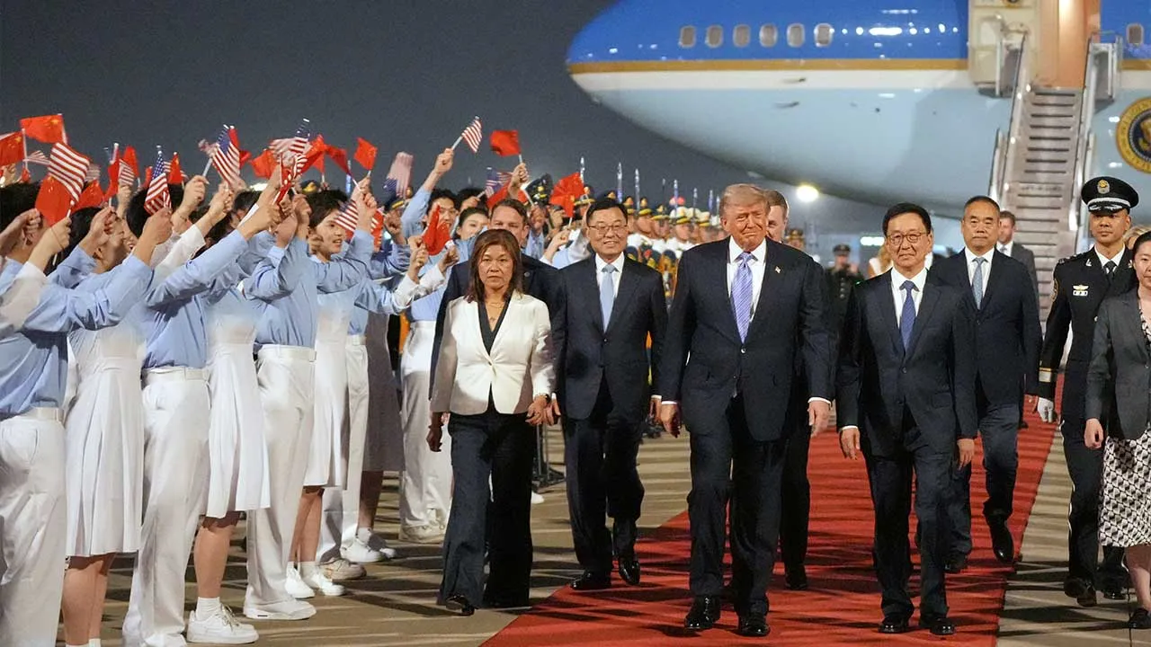 President Donald Trump walks with China's Vice President Han Zheng during a welcome ceremony Wednesday, May 13, 2026, at Beijing Capital International Airport in Beijing. (AP Photo/Mark Schiefelbein)
