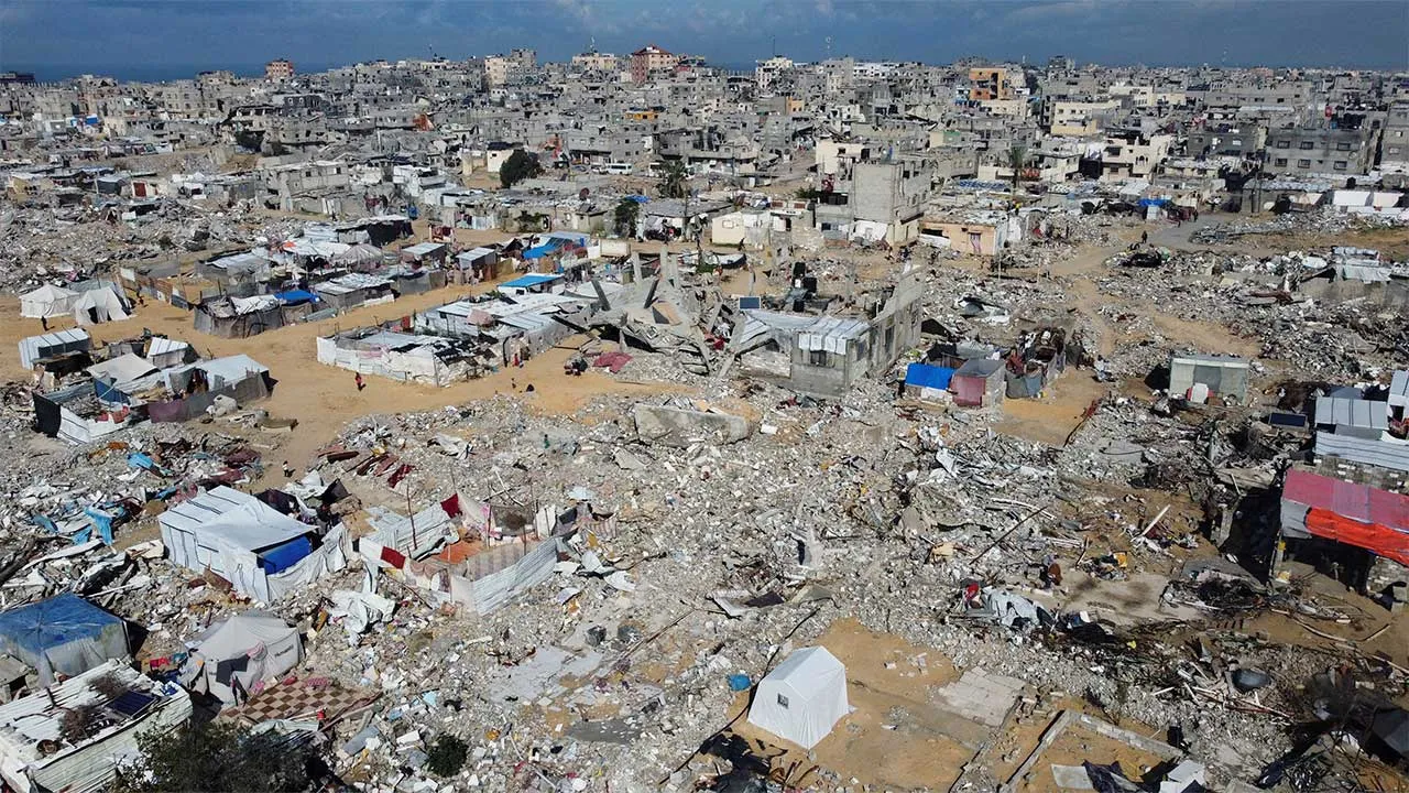 FILE PHOTO: A drone view shows damaged and destroyed buildings, destroyed in the Israeli military offensive, following a ceasefire between Israel and Hamas, in Khan Younis in the southern Gaza Strip January 24, 2025. REUTERS/Mohammed Salem/File Photo