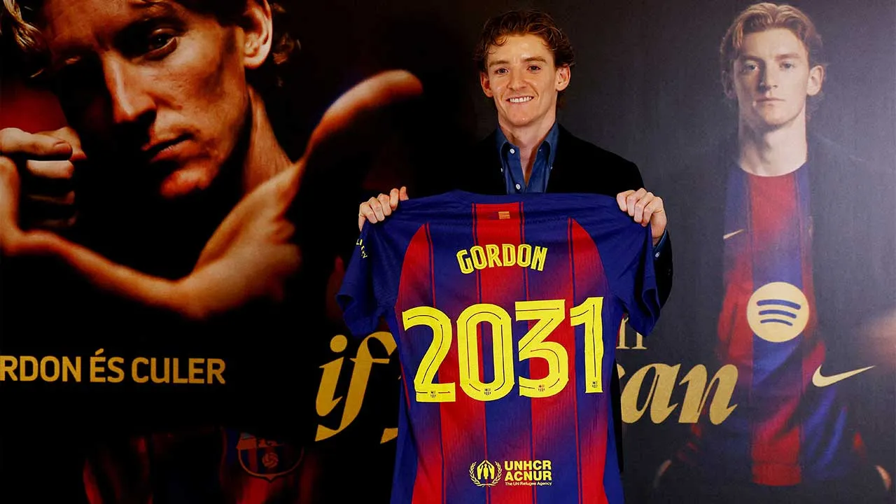 Soccer Football - Anthony Gordon signs for FC Barcelona - Spotify Camp Nou, Barcelona, Spain - May 29, 2026 Anthony Gordon poses as he holds a shirt after signing for FC Barcelona REUTERS/Albert Gea TPX IMAGES OF THE DAY