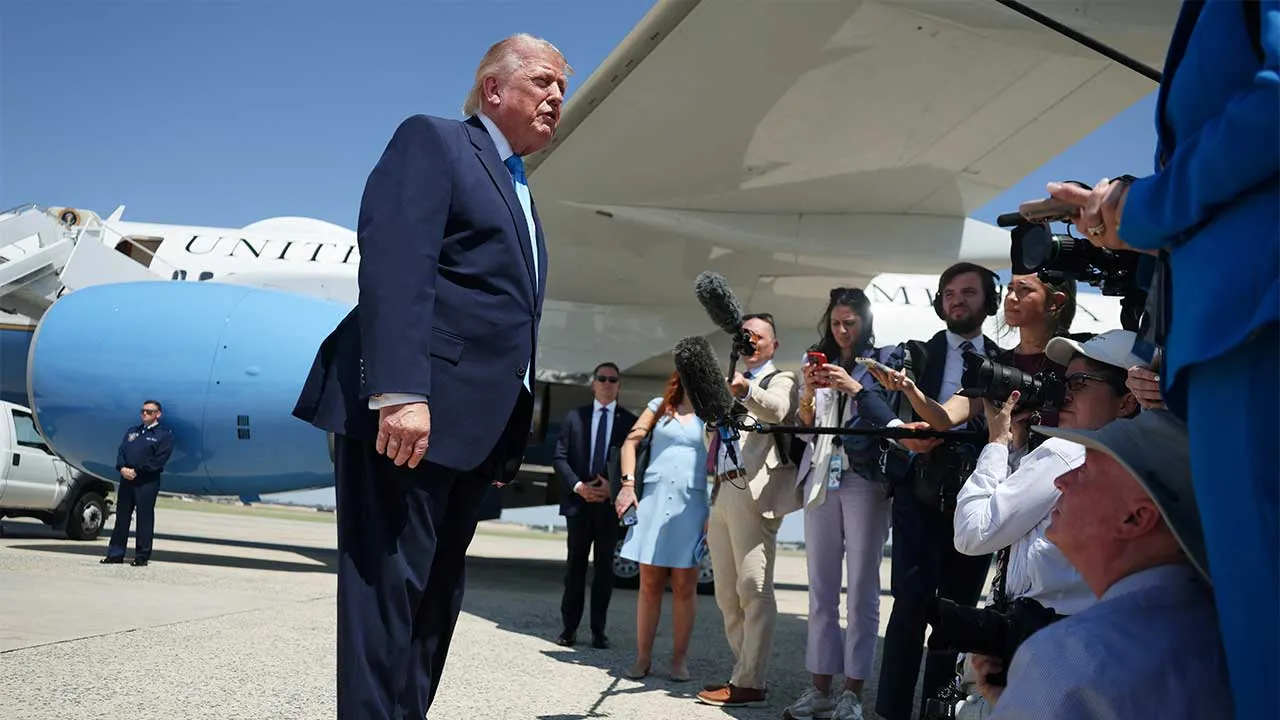 U.S. President Donald Trump speaks to members of the media as he arrives at Joint Base Andrews in Maryland, U.S., May 20, 2026. REUTERS/Evelyn Hockstein
