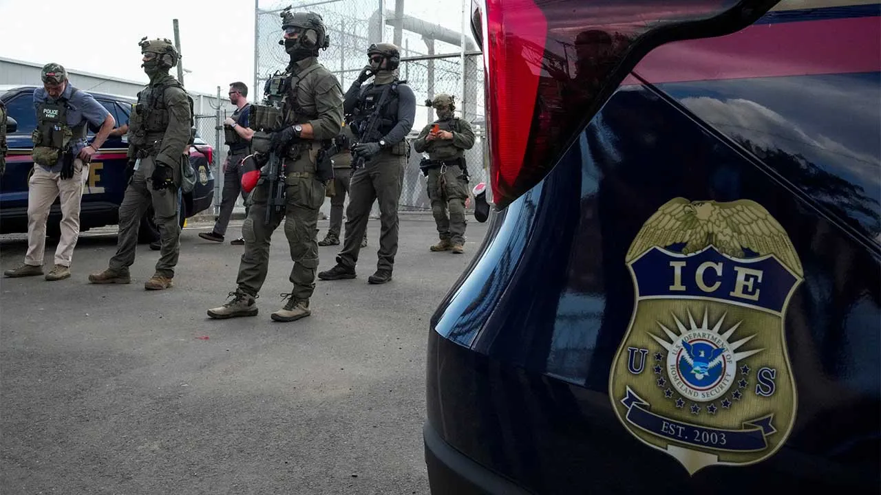 U.S. Immigration and Customs Enforcement (ICE) agents and federal agents secure the entrance to the Delaney Hall detention center, as demonstrators remain gathered outside, in Newark, New Jersey, U.S., May 29, 2026. REUTERS/Eduardo Munoz