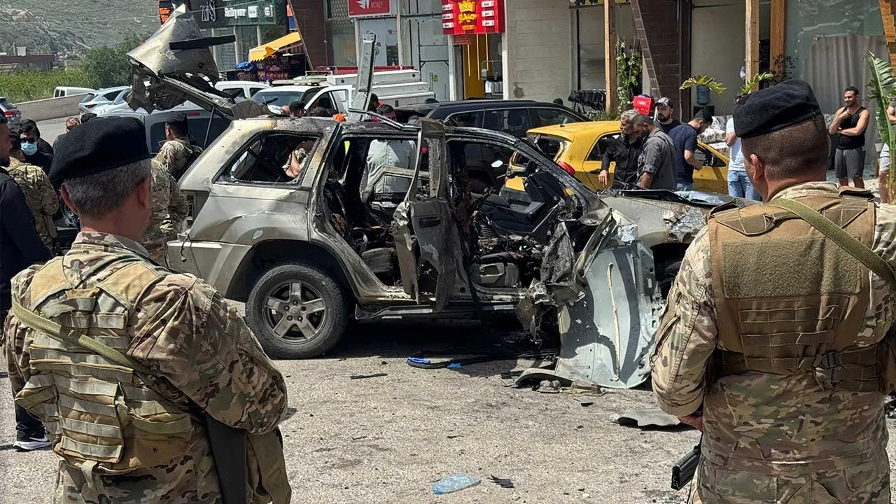 Lebanese army soldiers keep guard at the site of an Israeli strike on a car in Jiyeh area south of Beirut, Lebanon May 13, 2026. Picture taken with a mobile phone. REUTERS/Ali Hankir