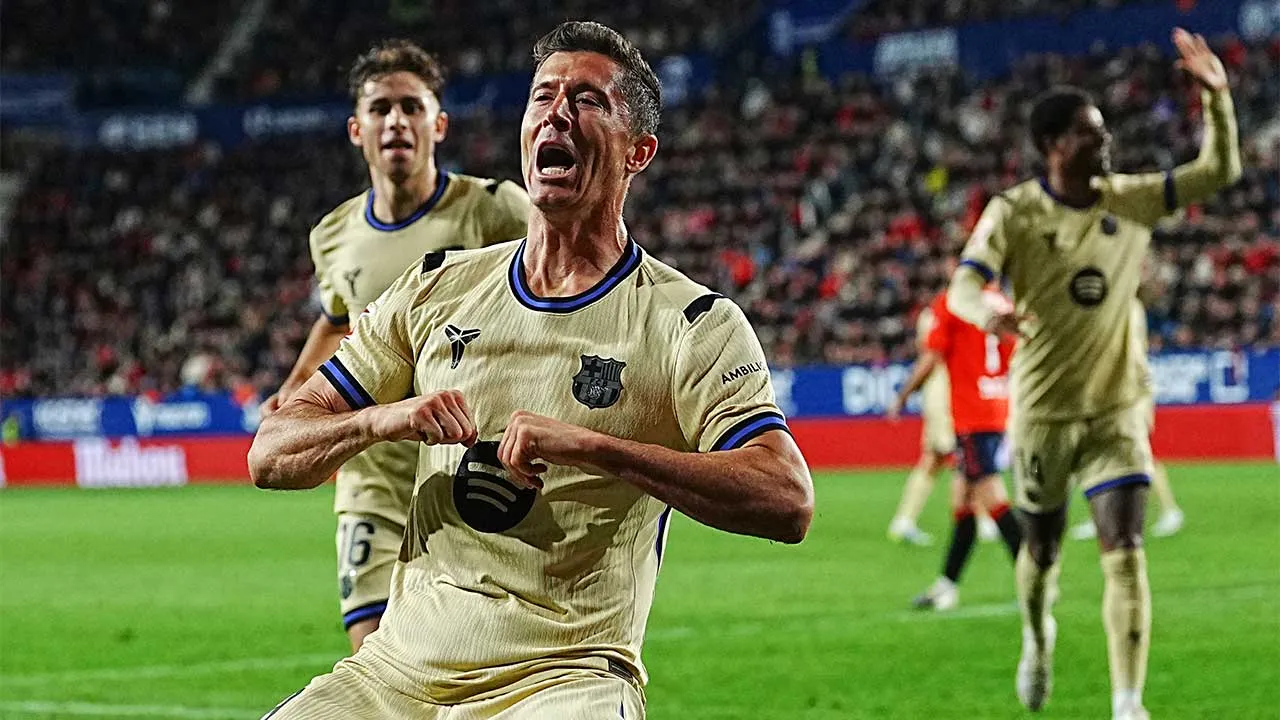 Barcelona's Robert Lewandowski celebrates after scoring his side's opening goal during a Spanish La Liga soccer match between Osasuna and Barcelona in Pamplona, Spain, Saturday, May 2, 2026. (AP Photo/Miguel Oses)