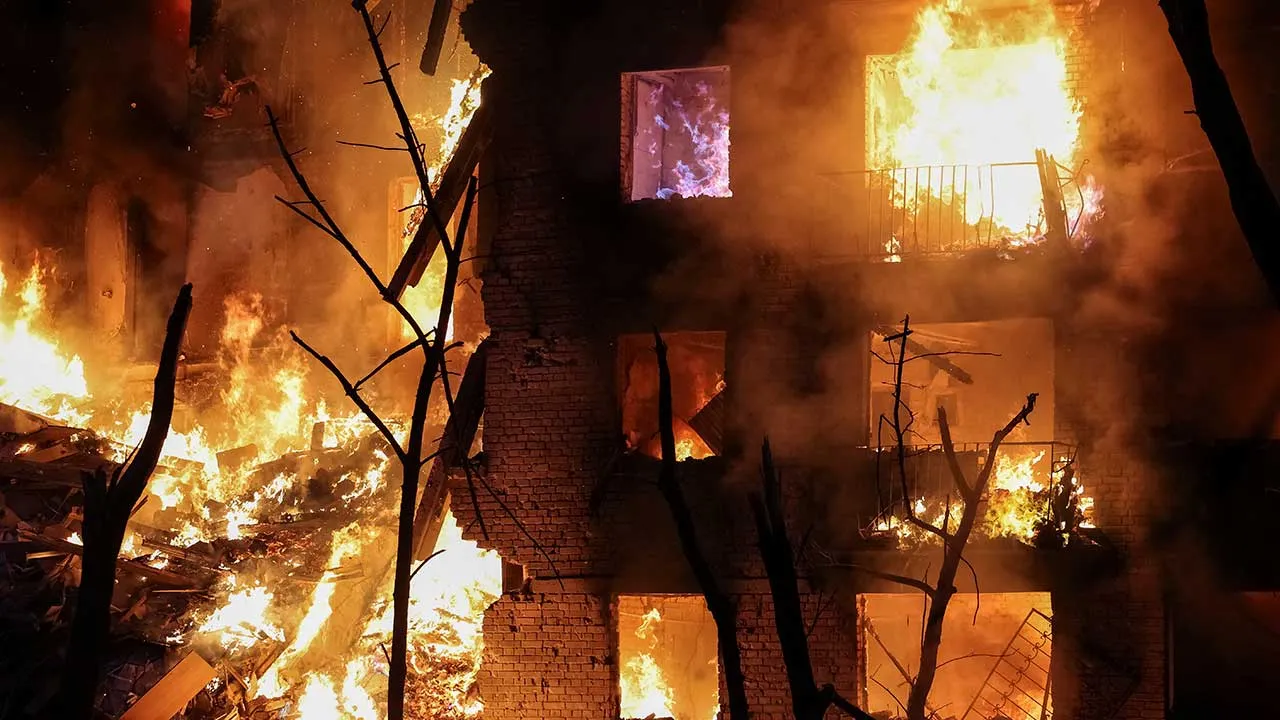 Fire engulfs an apartment building destroyed by a Russian missile and drone strike, amid Russia's attack on Ukraine, in Kyiv, Ukraine May 24, 2026. REUTERS/Stringer