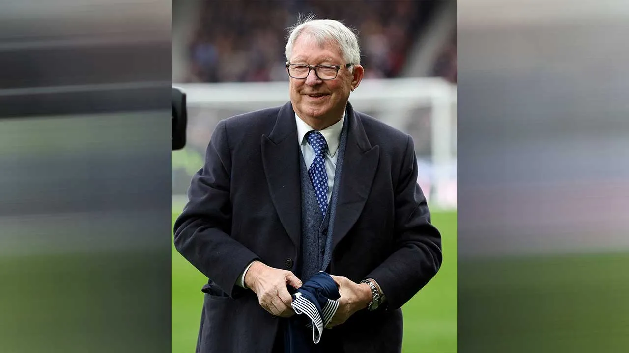 FILE PHOTO: Soccer Football - Nations League - Play-offs - Second Leg - Scotland v Greece - Hampden Park, Glasgow, Scotland, Britain - March 23, 2025 Alex Ferguson holds a shirt in tribute to former Scotland player Denis Law before the match REUTERS/Russell Cheyne/File Photo