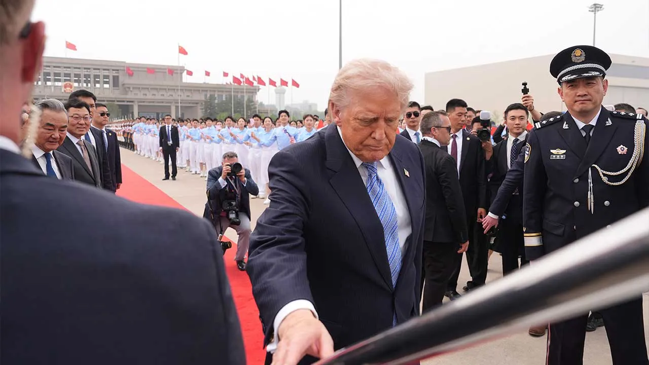 President Donald Trump boards Air Force One, Friday, May 15, 2026, at Beijing Capital International Airport in Beijing. (AP Photo/Mark Schiefelbein)