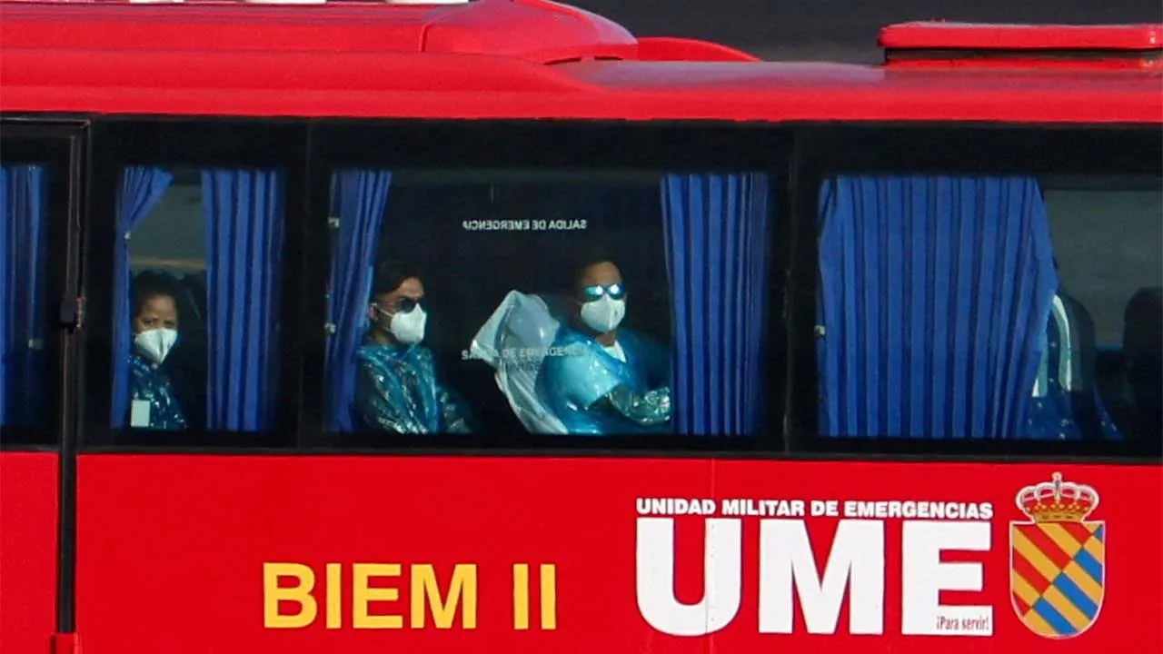 Passengers from the cruise ship MV Hondius, which was affected by a hantavirus outbreak, arrive to take a plane to the Netherlands, at Tenerife Sur airport, Canary Islands, Spain, May 11, 2026. REUTERS/Pedro Nunes