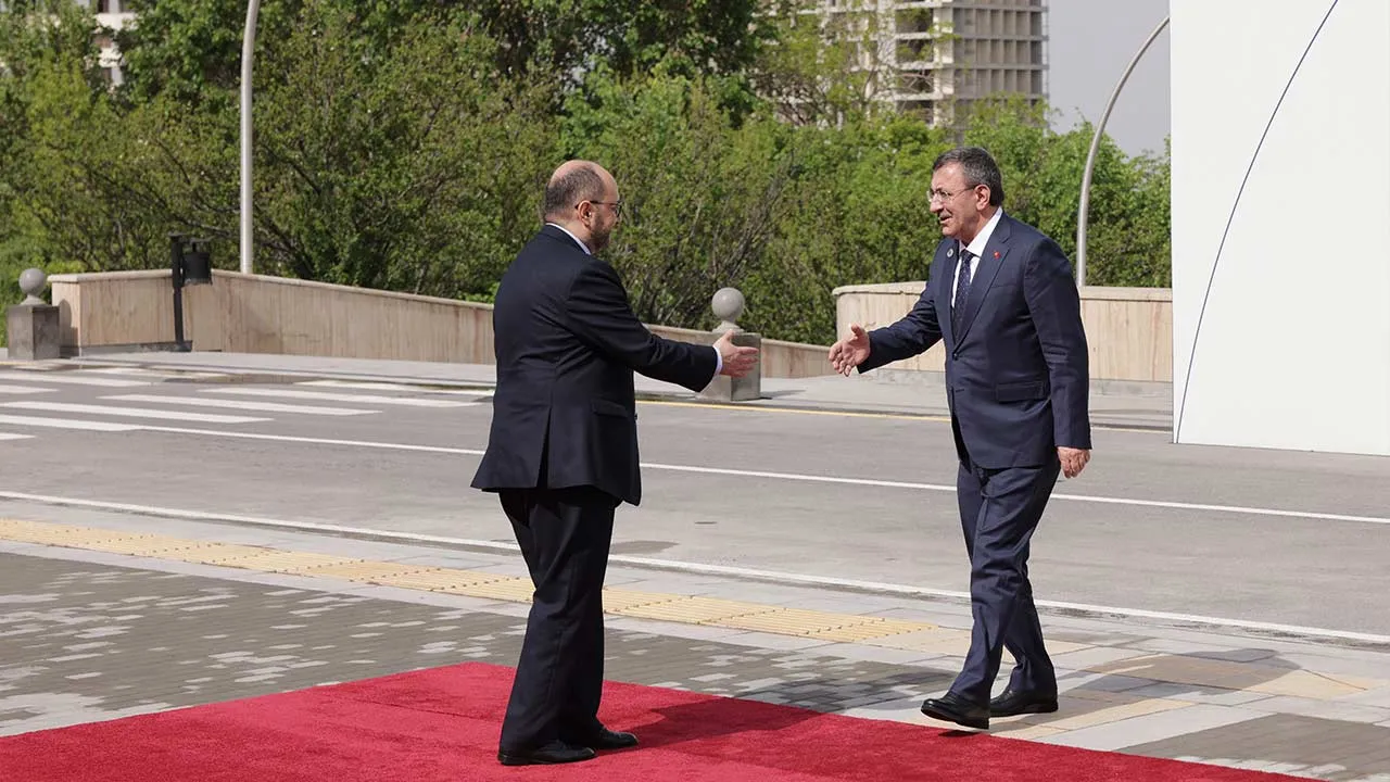 Turkey's Vice President Cevdet Yilmaz, right, arrives for a meeting of the European Political Community in Yerevan, Armenia, Monday, May 4, 2026. (AP Photo/Anthony Pizzoferrato)