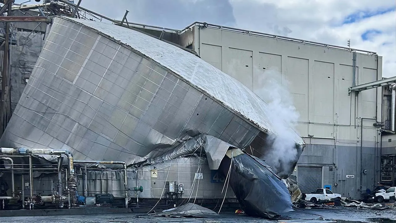 This photo provided by the City of Longview, Wash., shows structural damage to the Nippon Dynawave Packaging Co., after a tank containing hazardous liquid imploded, on Tuesday, May 26, 2026 in Longview, Wash. (City of Longview via AP)
