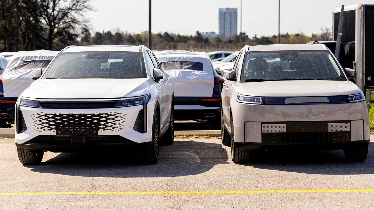 Vehicles identified as a Chinese-manufactured Chery Jaecoo J5 EV and an Omoda 9 plug-in hybrid are parked at a lot, following Canadian Prime Minister Mark Carney?s January deal with China to allow up to 49,000 Chinese-made electric vehicles (EVs) into Canada annually, in Toronto, Ontario, Canada, May 4, 2026. REUTERS/Carlos Osorio/File Photo