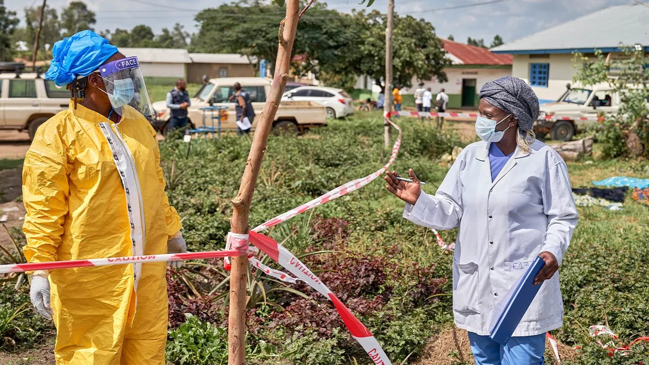Health workers chat at an Ebola treatment center in Bunia, Congo, Tuesday, May 19, 2026. (AP Photo/Dirole Lotsima Dieudonne)