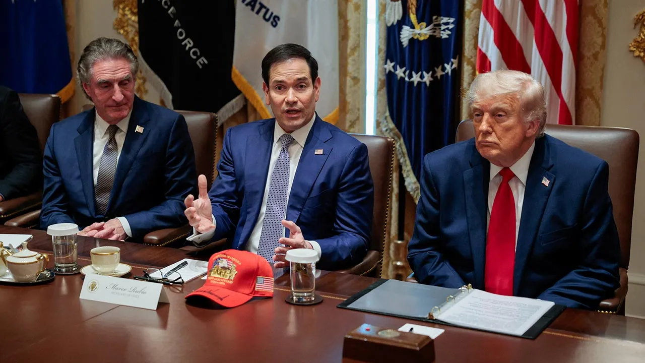 U.S. Secretary of State Marco Rubio speaks next to Interior Secretary Doug Burgum and U.S. President Donald Trump during a cabinet meeting in the Cabinet Room at the White House, in Washington, D.C., U.S., May 27, 2026. REUTERS/Evan Vucci