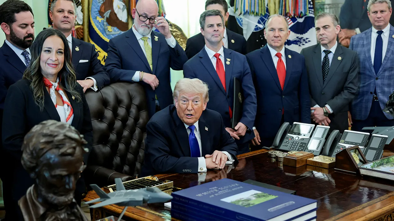 U.S. President Donald Trump takes questions from the media after signing an executive order in the Oval Office at the White House in Washington, D.C., U.S., April 30, 2026. REUTERS/Jonathan Ernst