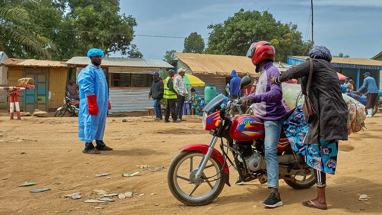 A moto taxi rider stops at a health screening checkpoint as aid agencies intensify efforts to contain an Ebola outbreak caused by the Bundibugyo virus in Mongbwalu, Djugu Territory, Ituri province, Democratic Republic of Congo, May 23, 2026. REUTERS/Gradel Muyisa Mumbere