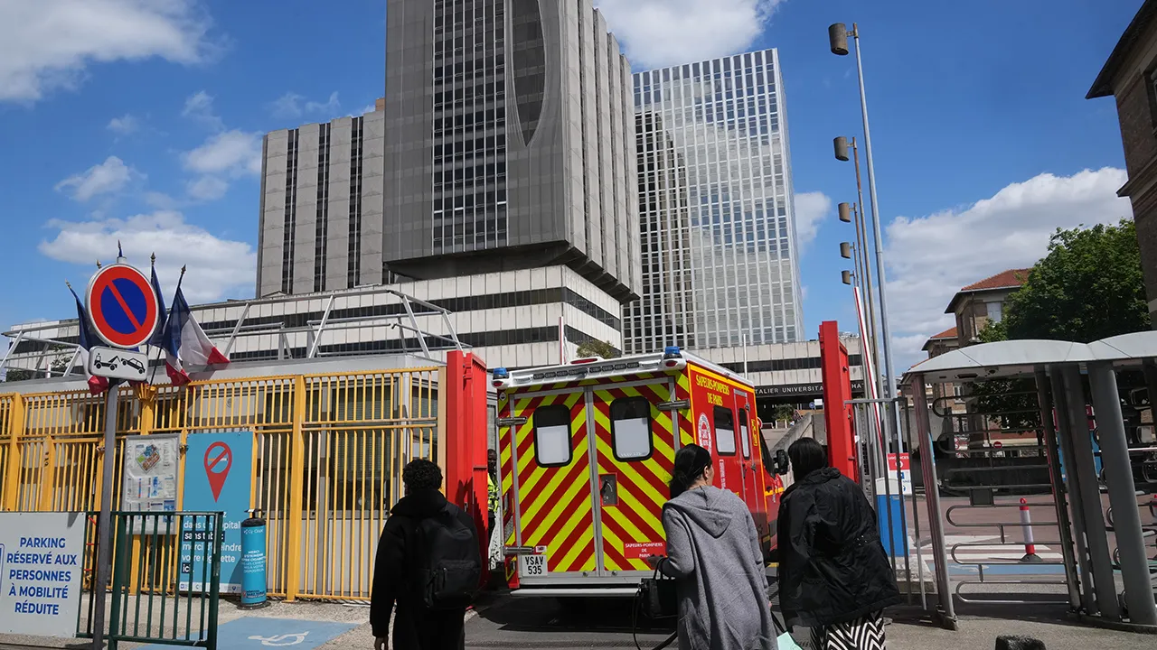 An ambulance enters the Bichat Hospital where a woman who tested positive for hantavirus remains in intensive care, in Paris, Tuesday, May 12, 2026. (AP Photo/Michel Euler)