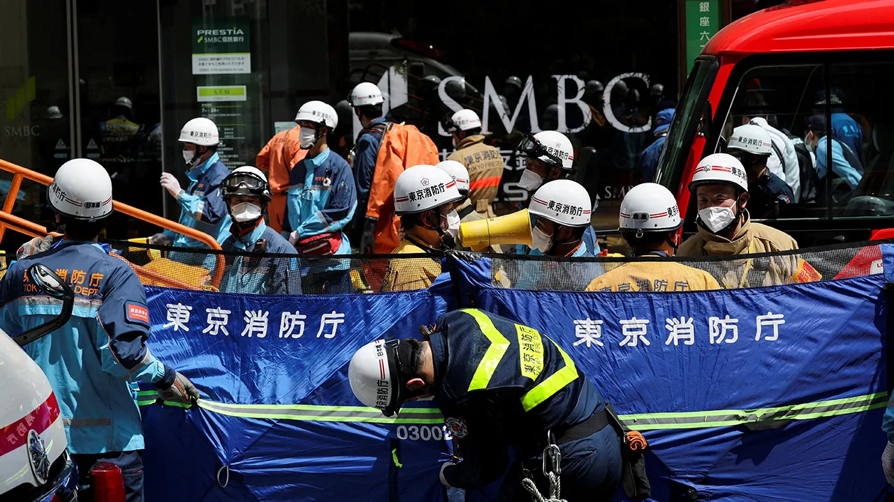Emergency services workers gather in front of the Ginza Six shopping complex, after an irritant was sprayed by an unknown person, in Tokyo, Japan May 25, 2026. REUTERS/Issei Kato
