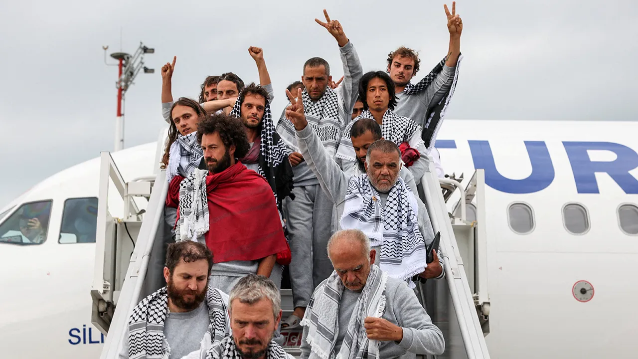 Activists from the Gaza-bound Global Sumud Flotilla, detained by Israeli forces after their vessels were intercepted in international waters in the Mediterranean, disembark a plane upon arrival at Istanbul Airport, Turkey, May 21, 2026. REUTERS/Murad Sezer