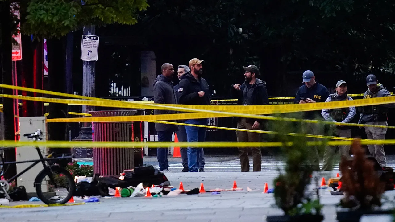 FBI agents stand in a cordoned-off area near the White House after a shooting incident in Washington, D.C., U.S., May 23, 2026. REUTERS/Nathan Howard