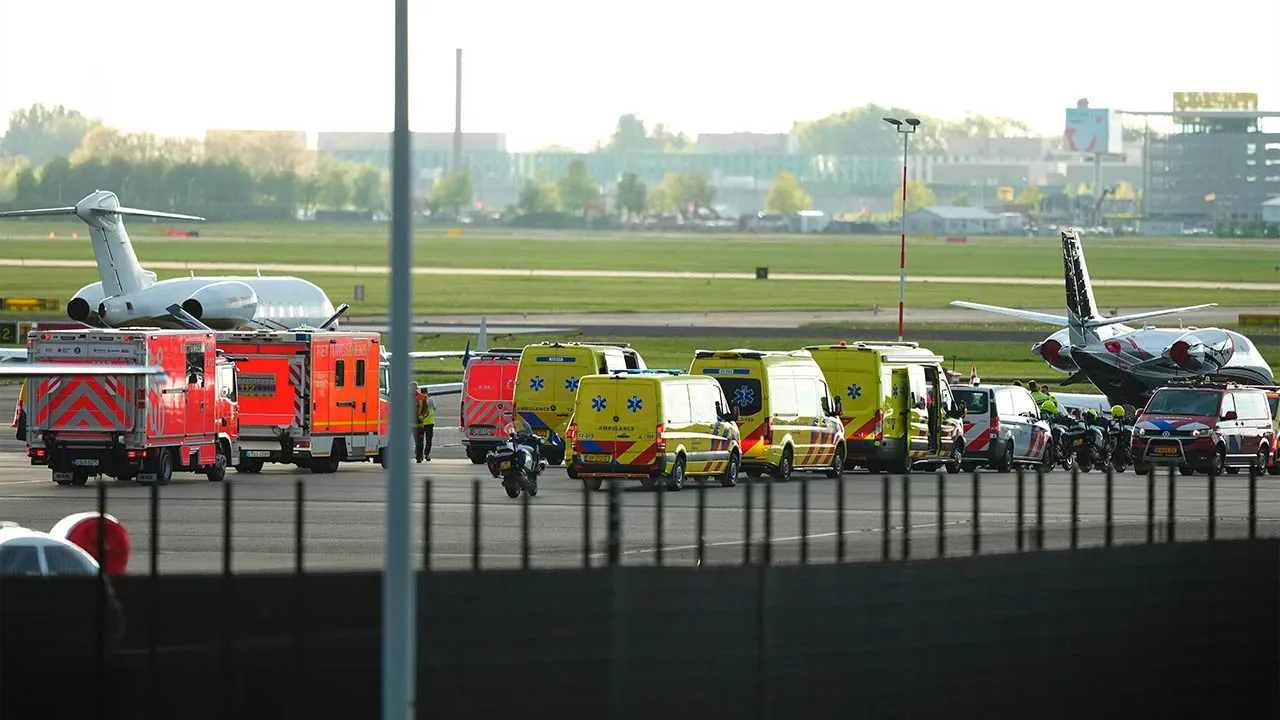 Ambulances are waiting for three patients, evacuated from the MV Hondius cruise ship with suspected hantavirus infection at Schiphol airport, Amsterdam, Netherlands, Wednesday, May 6, 2026. (AP Photo/Peter Dejong)
