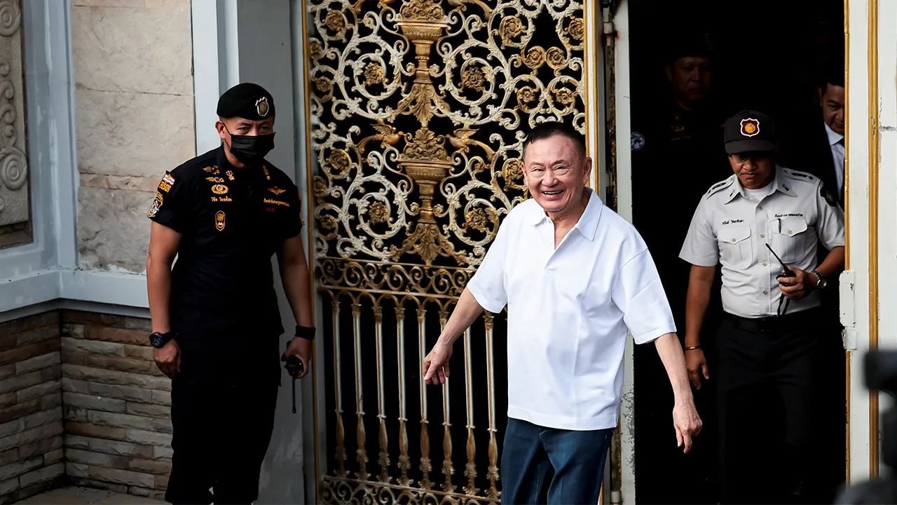 Former Thai Prime Minister Thaksin Shinawatra reacts following his release on parole after serving eight months of his one-year sentence at Klong Prem Central Prison, in Bangkok, Thailand, May 11, 2026. REUTERS/Chalinee Thirasupa