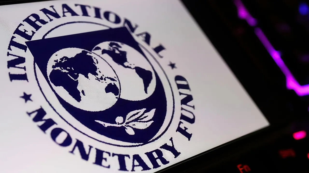 Viersen, Germany - January 9. 2024: Smartphone screen with logo lettering of IMF international monetary fond on computer keyboard -- ADOBE STOCK
