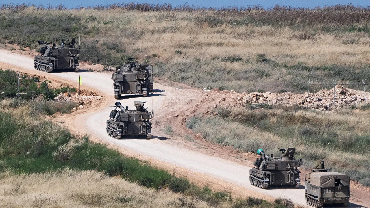 An Israeli military artillery unit drives into Lebanon after crossing the Israeli‑Lebanese border, as seen from northern Israel, May 27, 2026. REUTERS/Rami Shlush ISRAEL OUT