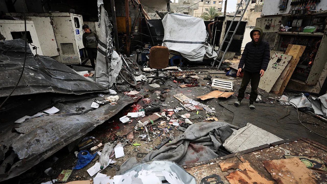 Palestinian children inspect the site of an Israeli strike that took place on Tuesday, at Al-Shati camp, in Gaza City, April 15, 2026. REUTERS/Dawoud Abu Alkas