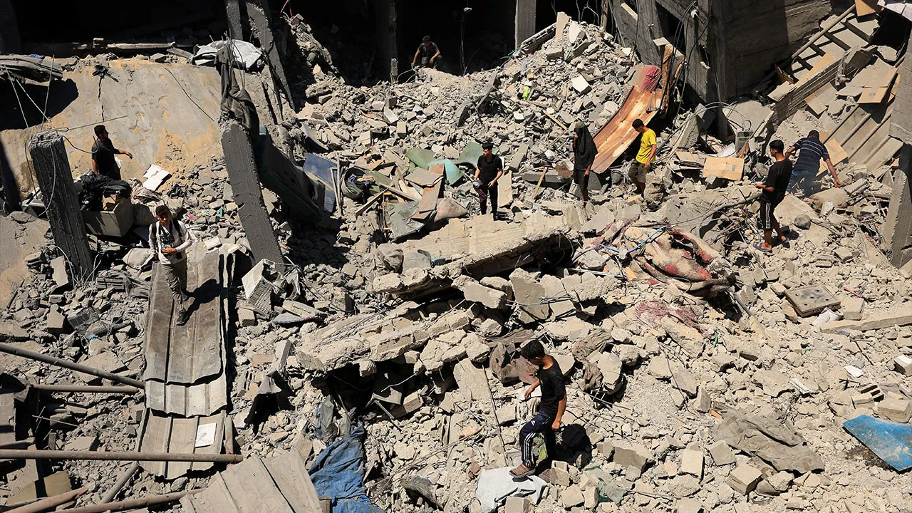 Palestinians inspect the site of an Israeli strike on a house that was pre-warned by the Israeli military to evacuate, before the strike was carried out late on Thursday at Shati (Beach) refugee camp, in Gaza City, May 29, 2026. REUTERS/Dawoud Abu Alkas