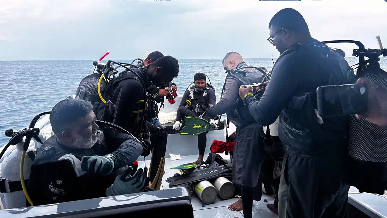 This image released by the Maldives President's Media Division, shows divers preparing to search for the four missing Italian divers near Alimathaa Island, Vaavu Atoll, Maldives, Saturday, May 15, 2026. (Maldives President's Media Division via AP)