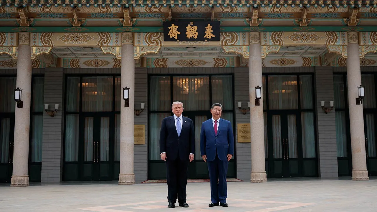 U.S. President Donald Trump poses for a picture with Chinese President Xi Jinping during a visit to the Zhongnanhai Garden in Beijing, China, May 15, 2026. REUTERS/Evan Vucci/Pool