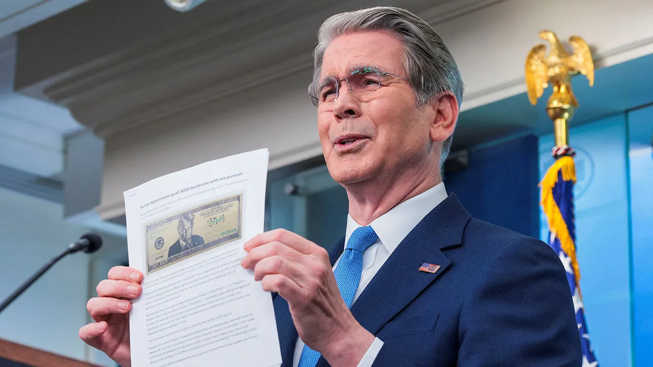 U.S. Treasury Secretary Scott Bessent holds up a Washington Post article about a proposed 250 dollar bill with the portrait of U.S. President Donald Trump during a press briefing in the James S. Brady Press Briefing Room at the White House in Washington, D.C., U.S., May 28, 2026. REUTERS/Kylie Cooper