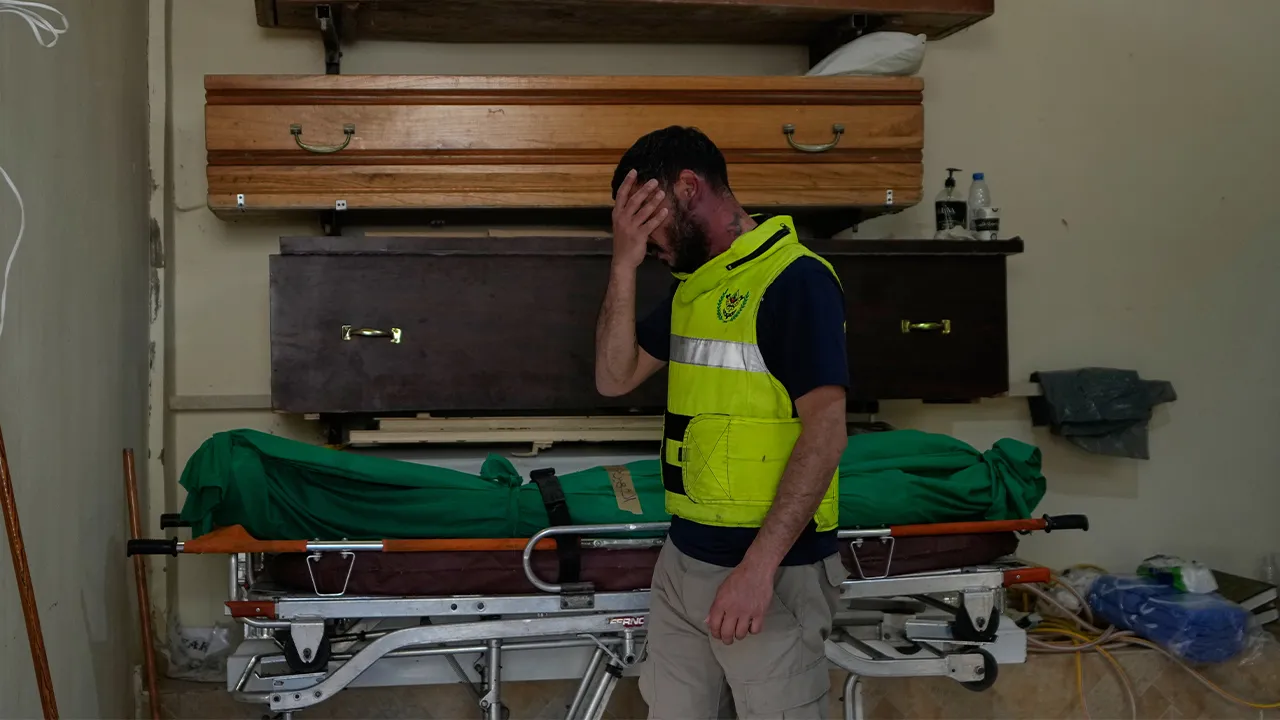 A civil defense worker reacts near the body of a person killed in an Israeli airstrike a day earlier in the village of Saksakieh, in Sidon, south Lebanon, Sunday, May 10, 2026. (AP Photo/Mohammed Zaatari)