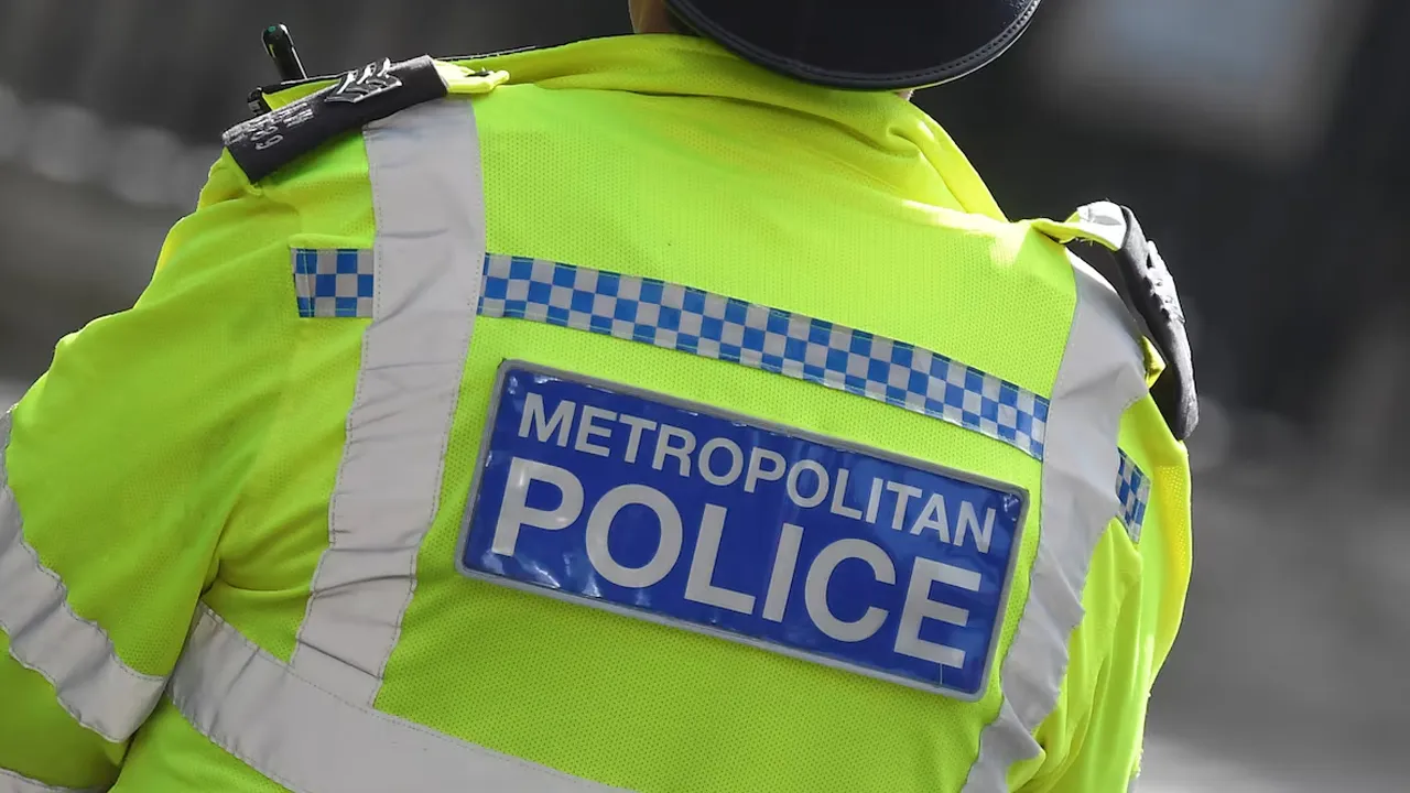 A Metropolitan Police officer stands on duty in Westminster, London, Britain, October 1, 2021. REUTERS/Toby Melville 